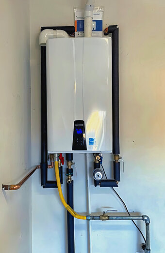 https://hamiltonhillhotwater.com.au/uploads/2025/06/instant-hot-water-systems-63860.jpg